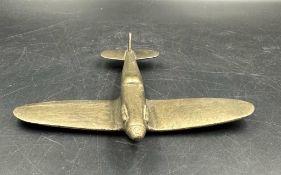 A Trench art plane in brass.