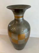 A vase with a checker pattern to centre