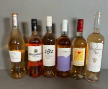 A selection of six bottles of Rose wine various makers, styles and years. See Photos