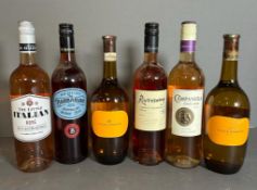 A selection of six bottles of red wine, various styles, makers and years.