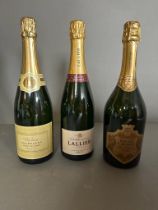 A selection of three bottles of various champagne. See Photos.