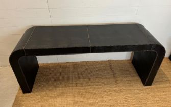 A console table with stud detail and faux leather (H75cm W180cm D51cm)