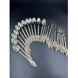 A set of twelve filigree decorated continental silver, marked 800 spoons and forks.