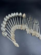 A set of twelve filigree decorated continental silver, marked 800 spoons and forks.