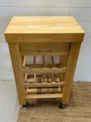 A free standing kitchen block with wine rack on wheels (H92cm W56cm D38cm)