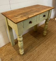 A farmhouse pine side unit with two drawers and turned front legs (H76cm W87cm D43cm)