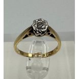 An 18ct yellow gold and platinum set diamond ring, approximate size J1/2