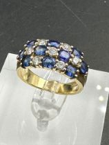 A sapphire and diamond chequerboard ring on 18ct gold mount, marked 750 Size M
