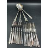 A selection of quality silver plate cutlery, knives forks and serving spoons, marked A1