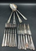 A selection of quality silver plate cutlery, knives forks and serving spoons, marked A1