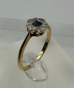 An 18ct diamond and blue central stone antique ring, approximate size \m