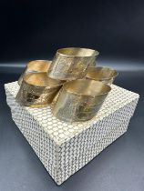 A boxed set of six Continental silver napkin rings