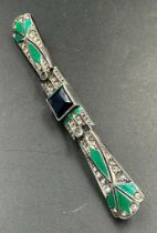 An Art Deco brooch with central blue stone