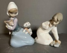 Two boxed Lladro figures, a girl on her knees with puppies and a girl with slippers Condition Report
