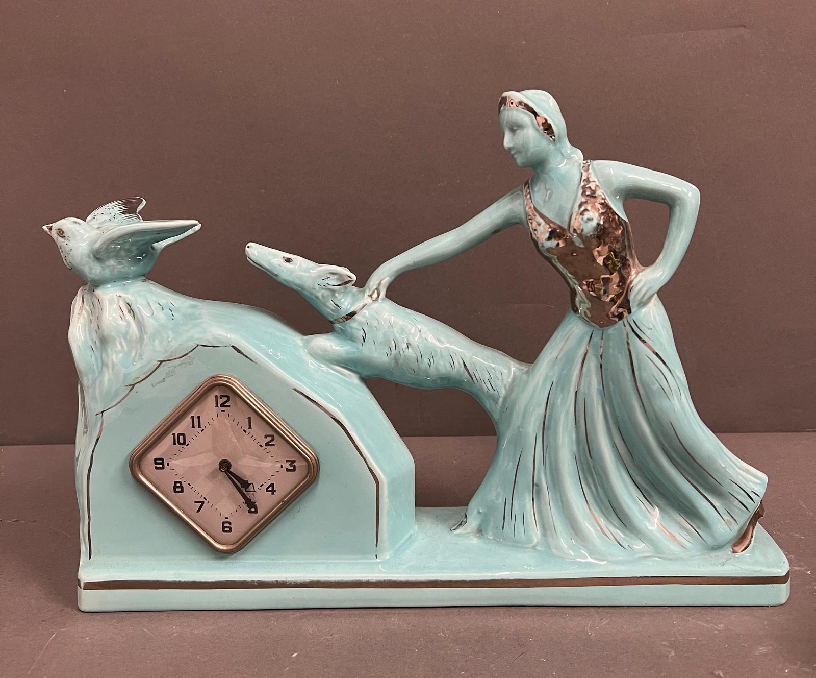 Art Deco French mantle clock, the ceramic lady holding her dog (H28cm W37cm)