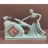 Art Deco French mantle clock, the ceramic lady holding her dog (H28cm W37cm)