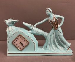 Art Deco French mantle clock, the ceramic lady holding her dog (H28cm W37cm)