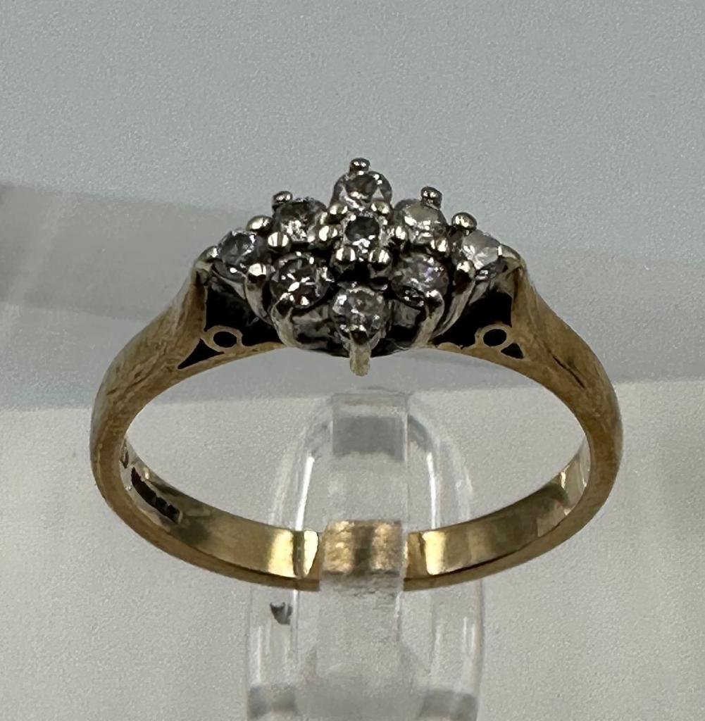 A 9ct gold ring with diamond cluster setting, approximate total weight 2.5g, size N