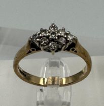 A 9ct gold ring with diamond cluster setting, approximate total weight 2.5g, size N