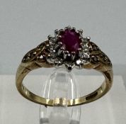 A 9ct gold ruby and diamond ornate ring in yellow gold setting, approximate size O1/2