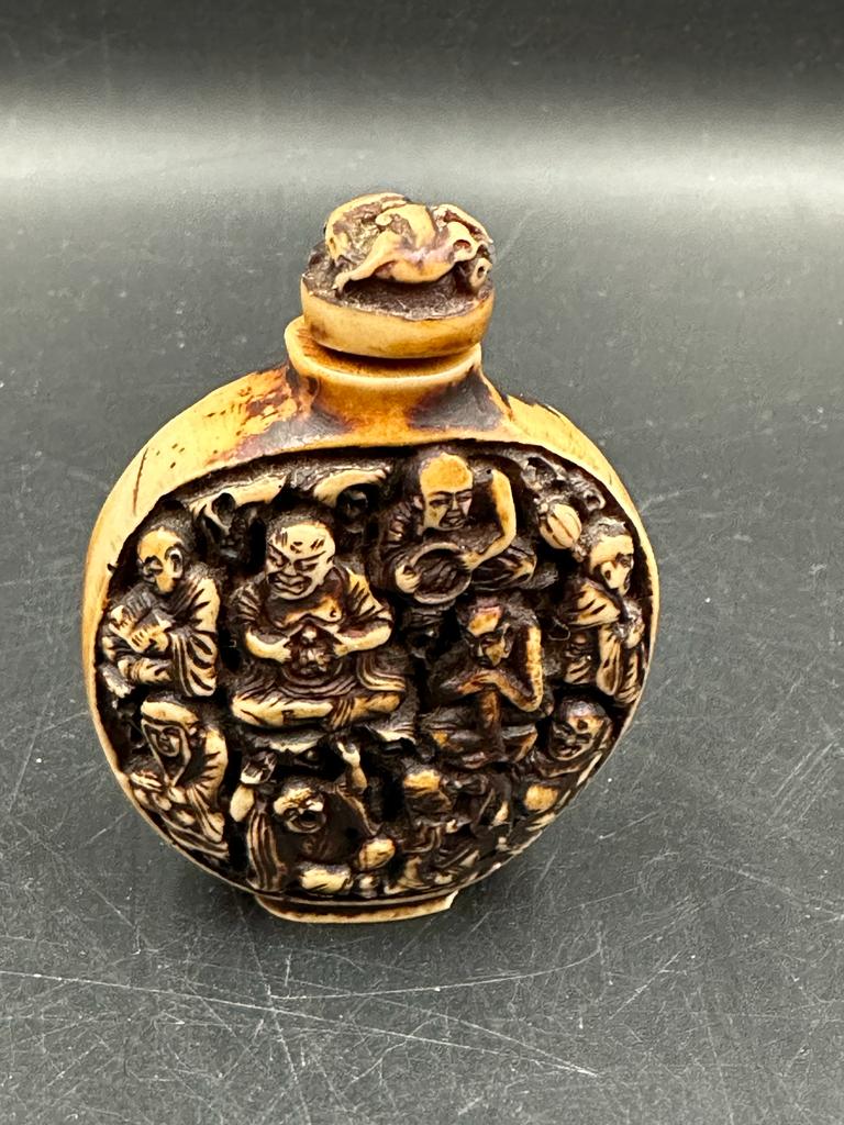 A Chinese hand carved resin snuff bottle depicting the Immortals - Image 3 of 3