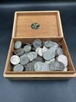 A quantity of USA quarter cent coins in wooden cigar box