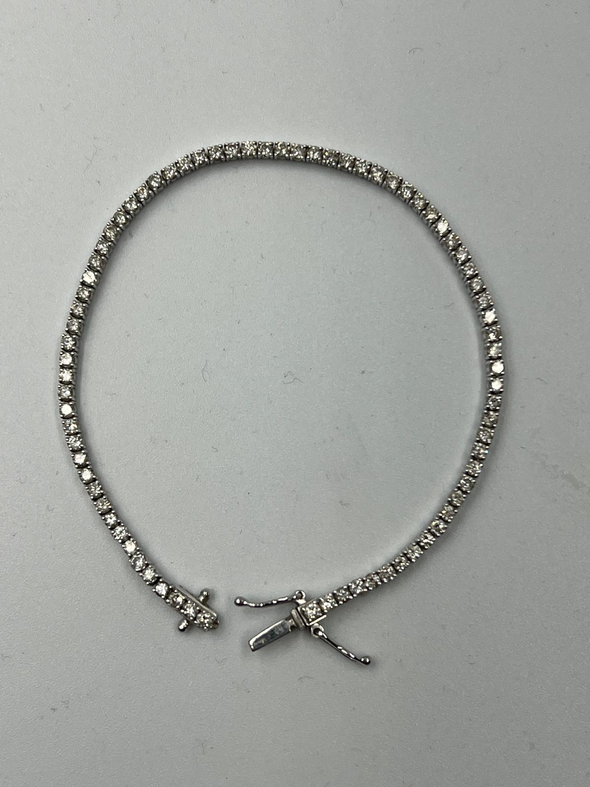 An 18ct white gold Tennis or line bracelet set with approximately 3ct of diamonds. - Image 4 of 25