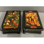 Two lacquered boxes with village scene to front (17cm x 12cm)