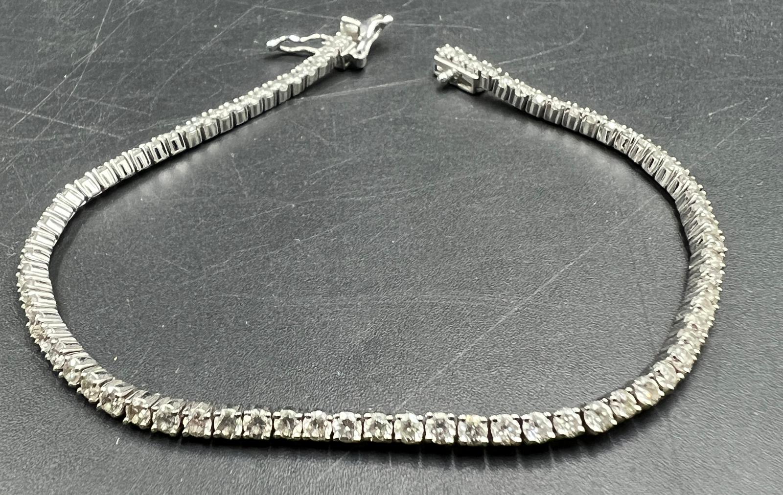 An 18ct white gold Tennis or line bracelet set with approximately 3ct of diamonds. - Image 20 of 25
