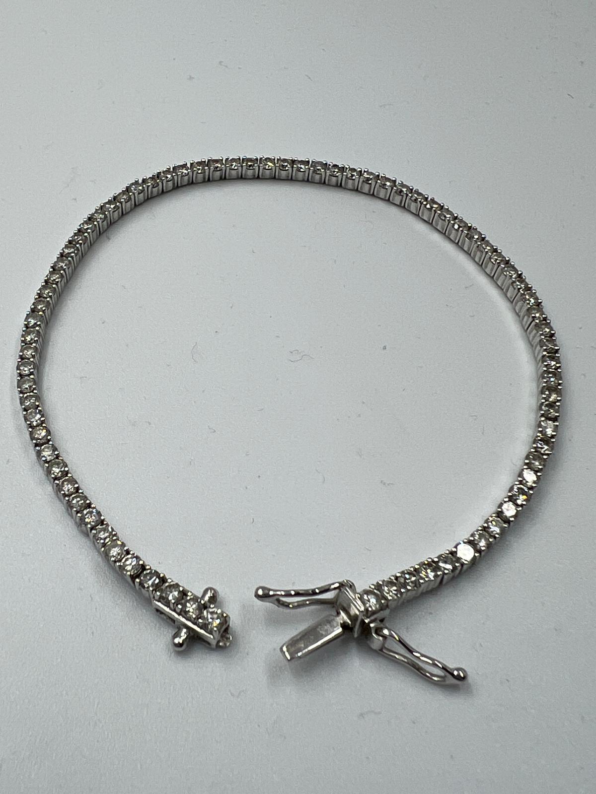 An 18ct white gold Tennis or line bracelet set with approximately 3ct of diamonds. - Image 15 of 25