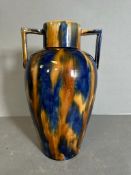 A Studio Pottery drip glaze vase in blues and browns