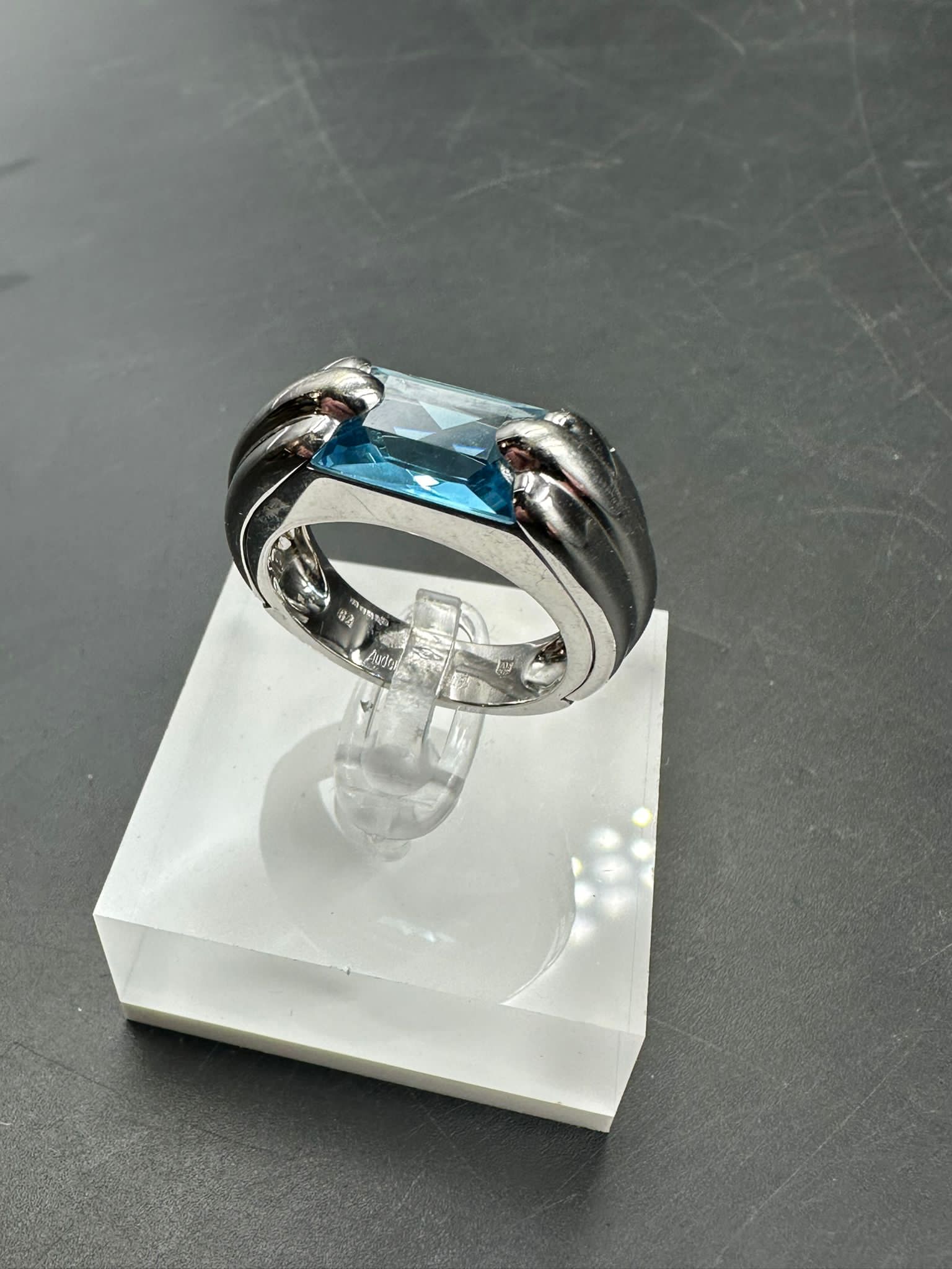 A single stone Audemars Piguet ring consisting of a rectangular mixed cut blue topaz stone (12.1mm x - Image 2 of 5