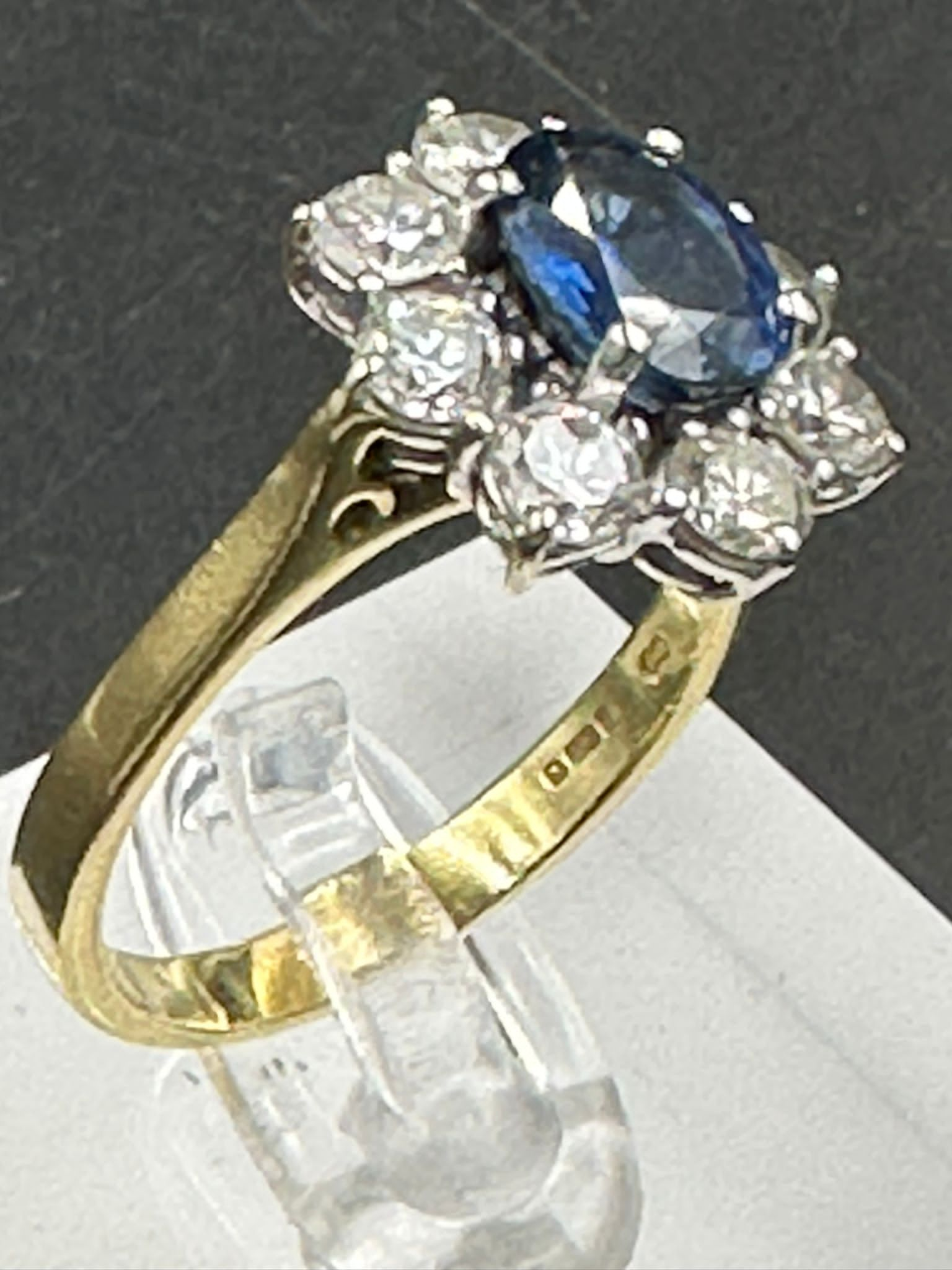 A sapphire and diamond cluster ring on an 18ct (750) shank. - Image 2 of 4