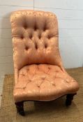 A mahogany framed button back bedroom chair upholstered in pink