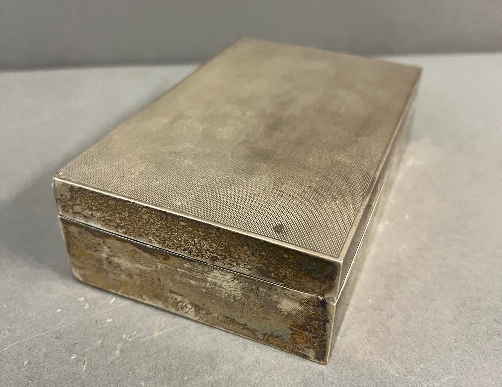 A Garrard and Co silver cigarette box with machine tooled decoration, Hallmarked for London 14cm x - Image 3 of 7