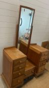 A Paul Matt for Brynmawr Arts and Crafts oak dressing table, eight drawers below swivel mirror (