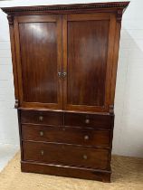 A mahogany linen press wardrobe in the style of Georgian moulded cornice over panelled doors (H212cm