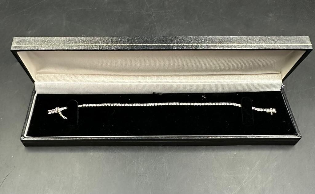 An 18ct white gold Tennis or line bracelet set with approximately 3ct of diamonds. - Image 25 of 25