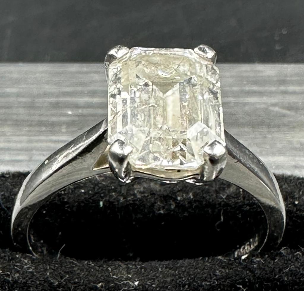 A 3.26ct emerald cut diamond which commercial White and PK3 quality, four claw platinum set on a - Image 5 of 5