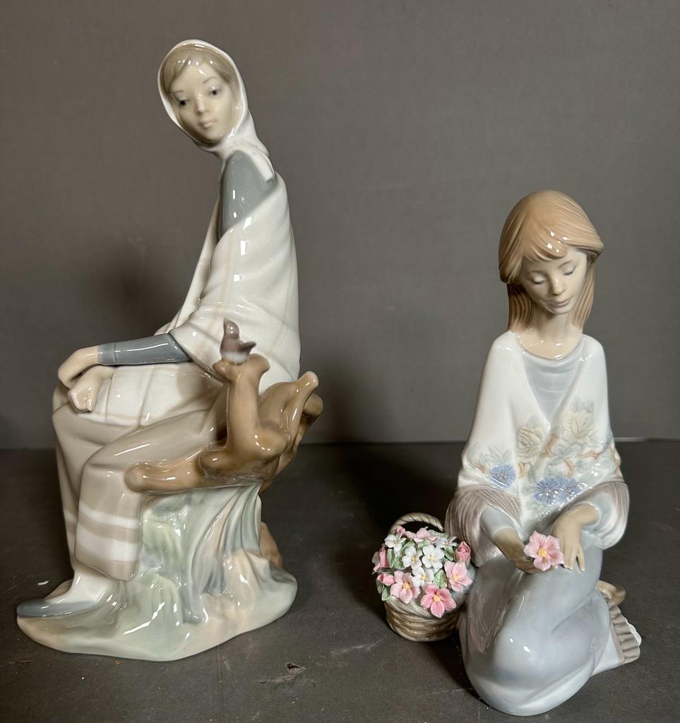 Two boxed Lladro figures, a seated lady with basket of flowers and a lady with a bird Condition