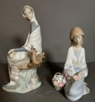 Two boxed Lladro figures, a seated lady with basket of flowers and a lady with a bird Condition