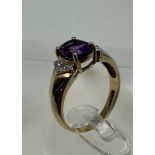 A 9ct gold amethyst and diamond ring, approximate size M1/2