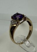 A 9ct gold amethyst and diamond ring, approximate size M1/2