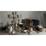 A quantity of silver plate to include saucer boats, picture frames and candle sticks