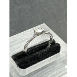 A single brilliant cut diamond, mounted in a four claw platinum ring. diamond weighing 0.36ct,