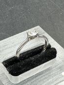 A single brilliant cut diamond, mounted in a four claw platinum ring. diamond weighing 0.36ct,