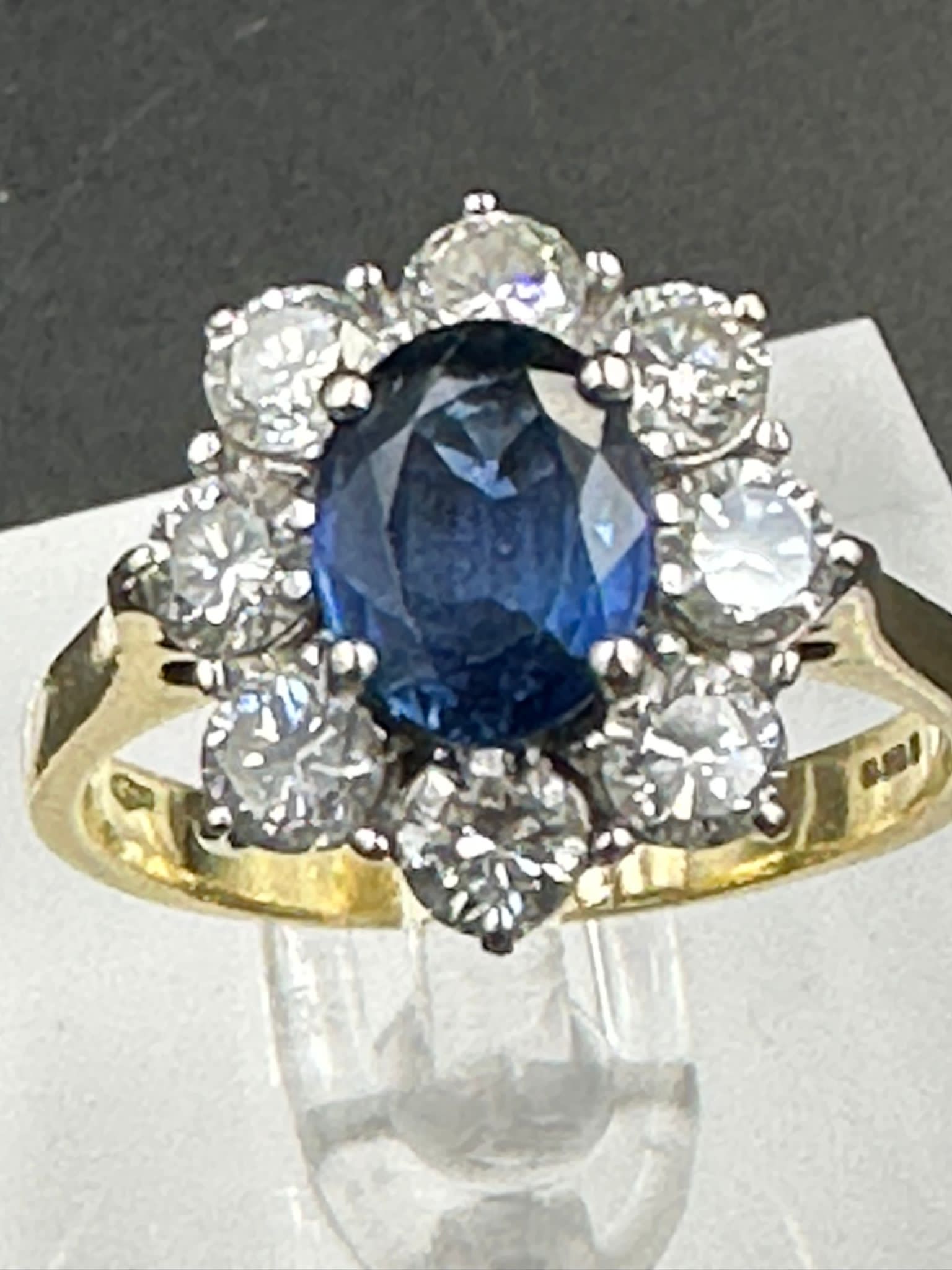 A sapphire and diamond cluster ring on an 18ct (750) shank. - Image 3 of 4