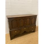 An oak Georgian three drawer and two door dresser (H104cm W150cm D54cm)