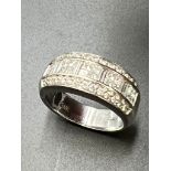 A 14ct white gold ring set with approximately 46 diamonds. Size N