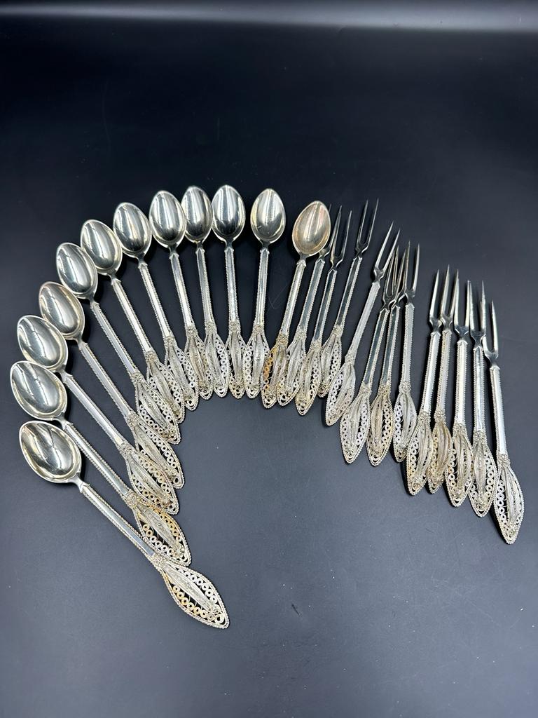 A set of twelve filigree decorated continental silver, marked 800 spoons and forks. - Image 2 of 2